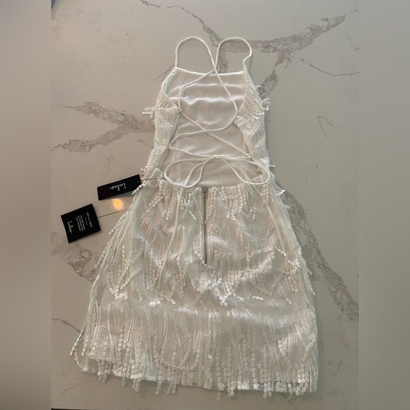 Lulu’s Making Magic White Fringe Lace-Up Mini Homecoming Dress - Picture 3 of 4